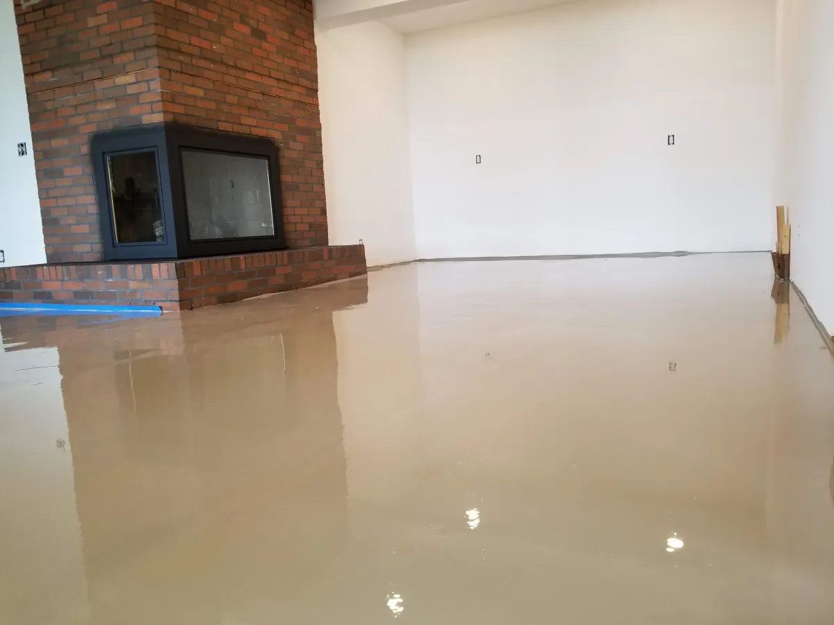 ATR Concrete Technologies worker applying floor coating