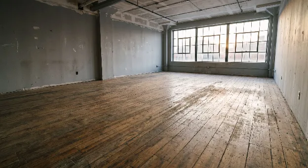 Existing commercial wood flooring prepared for refinishing