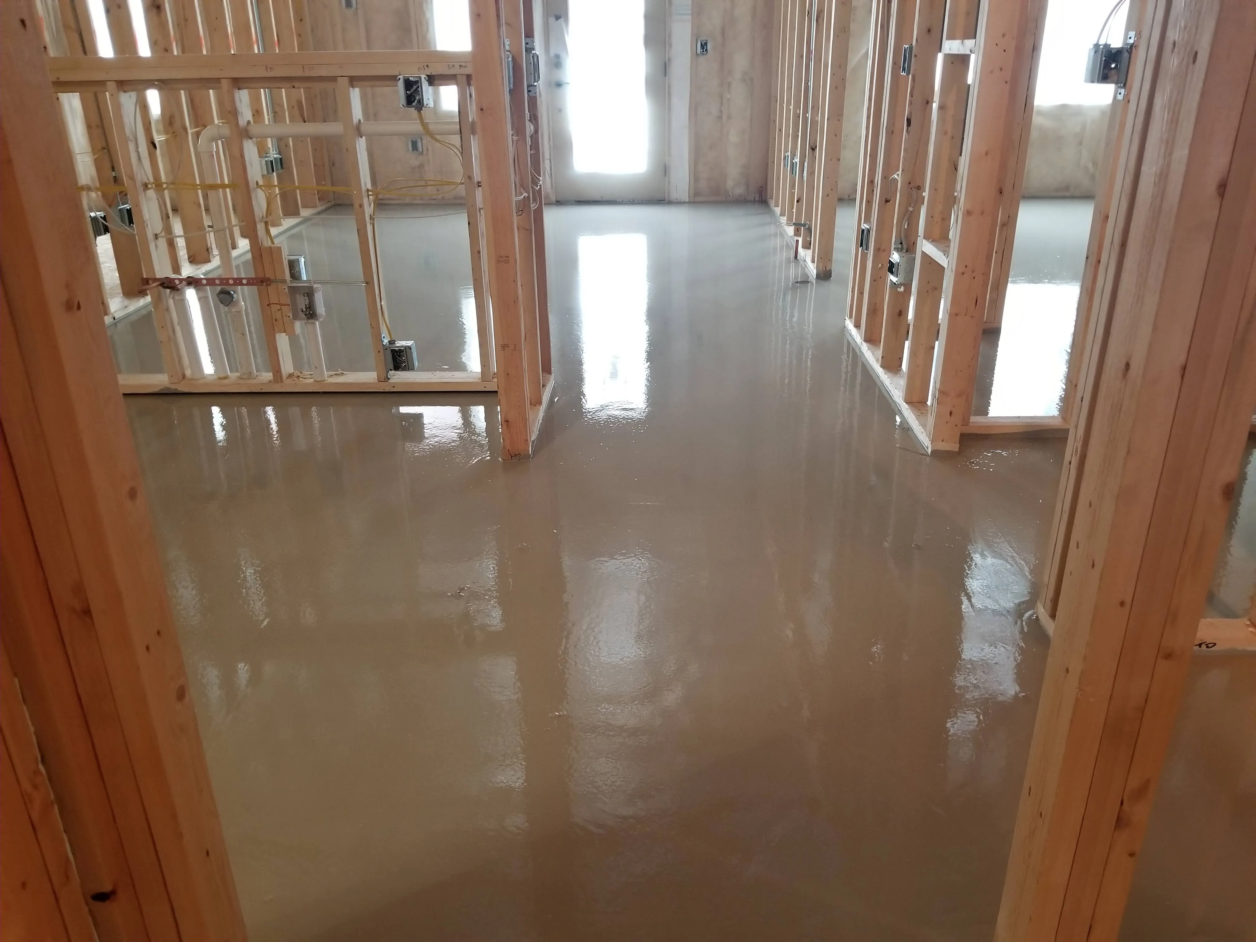 Finished underlayment across a framed residential interior