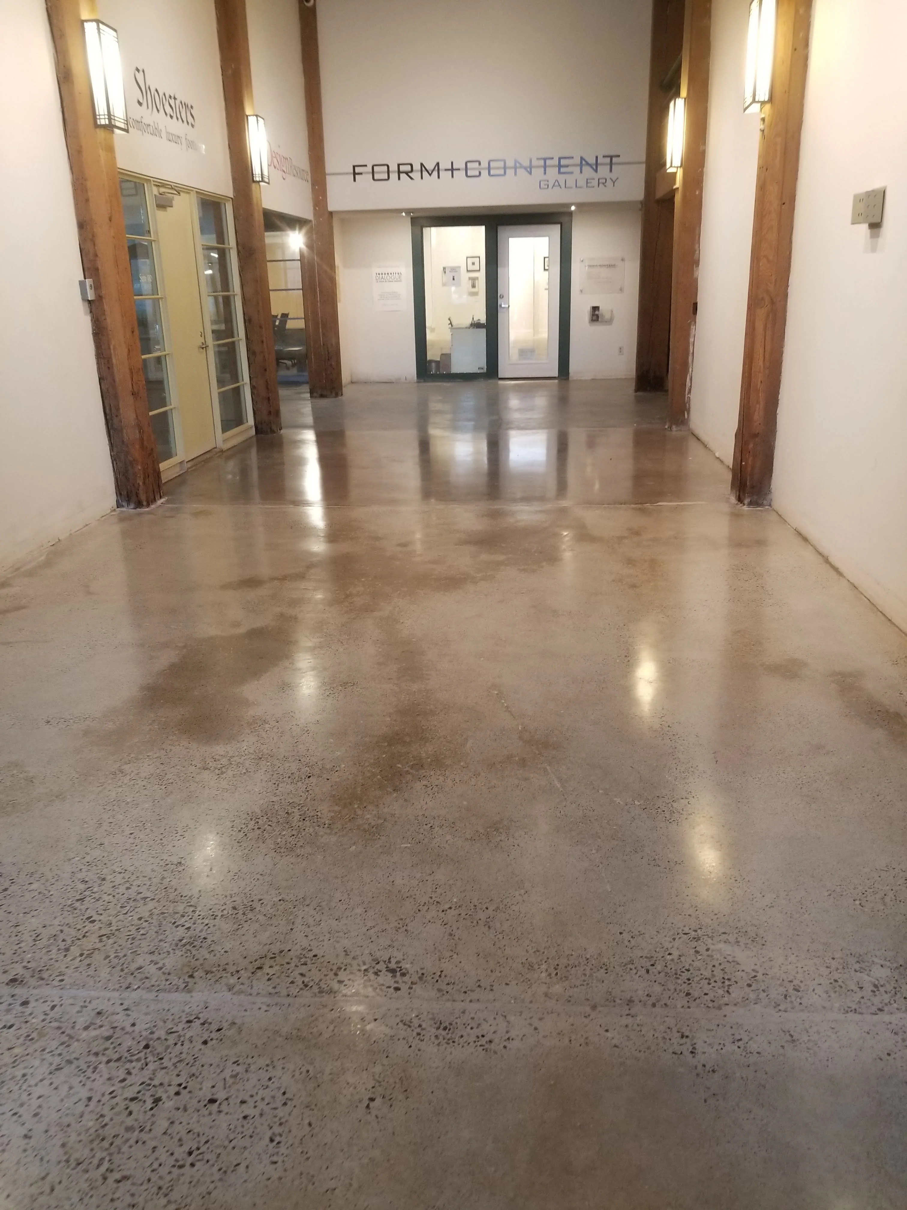 Completed polished concrete floor in a commercial gallery